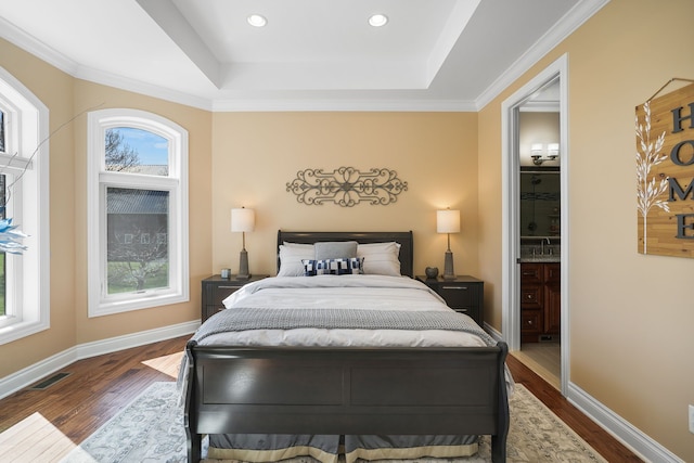 70799 Fisher Rd, Bruce, MI 48065 - bedroom with visible vents, a tray ceiling, dark wood finished floors, and multiple windows