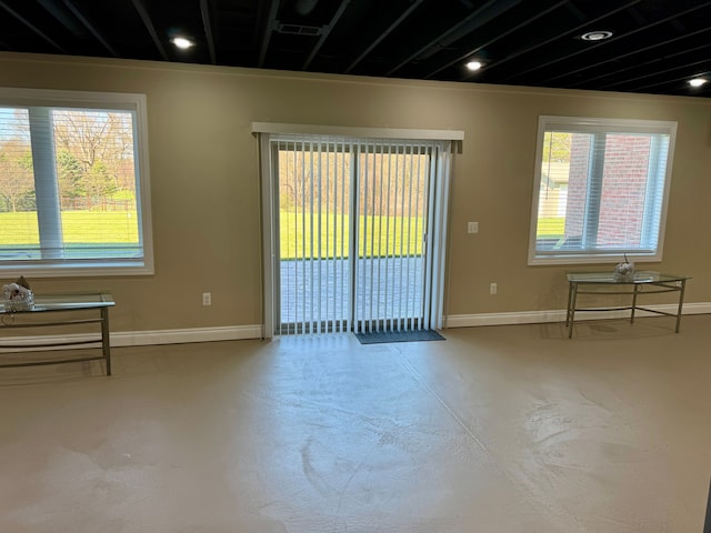 70799 Fisher Rd, Bruce, MI 48065 - empty room with concrete flooring and baseboards