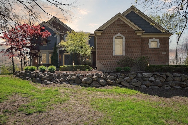 8504 Riverwalk Dr, Fenton, MI 48430 - view of front of house with brick siding and a front lawn