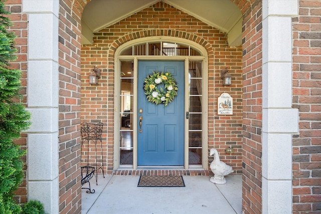 8504 Riverwalk Dr, Fenton, MI 48430 - view of exterior entry featuring brick siding