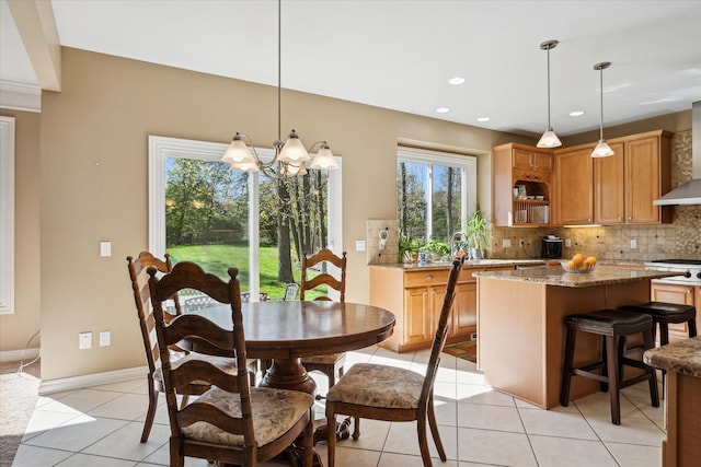 8504 Riverwalk Dr, Fenton, MI 48430 - dining room with light tile patterned floors, a chandelier, baseboards, and recessed lighting