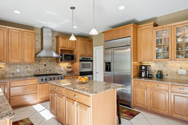 8504 Riverwalk Dr, Fenton, MI 48430 - kitchen with built in appliances, wall chimney range hood, backsplash, light tile patterned floors, and recessed lighting