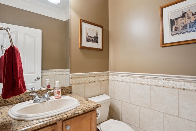 8504 Riverwalk Dr, Fenton, MI 48430 - bathroom featuring ornamental molding, vanity, wainscoting, toilet, and tile walls