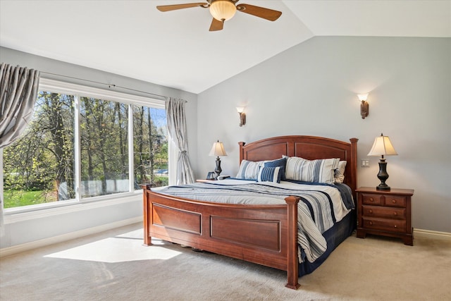 8504 Riverwalk Dr, Fenton, MI 48430 - bedroom with lofted ceiling, baseboards, carpet, and ceiling fan