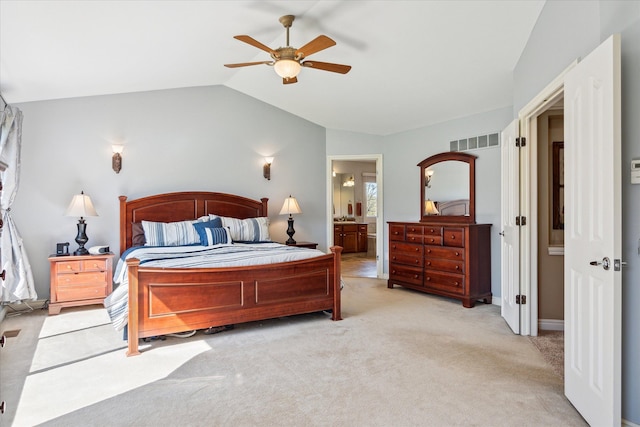 8504 Riverwalk Dr, Fenton, MI 48430 - bedroom with lofted ceiling, light colored carpet, ensuite bath, and ceiling fan