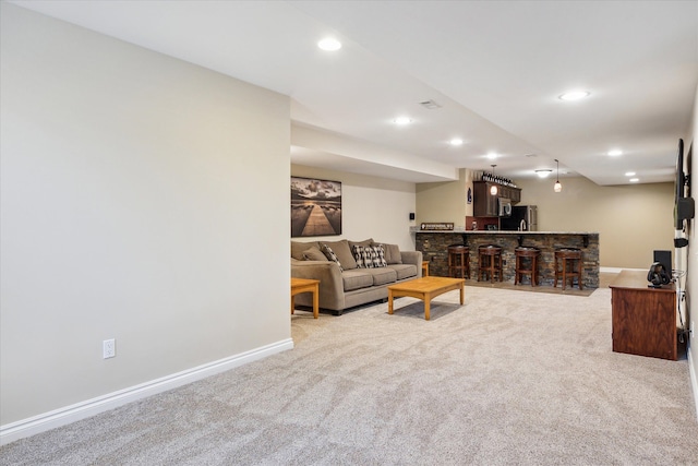 8504 Riverwalk Dr, Fenton, MI 48430 - living room featuring wet bar, light carpet, baseboards, and recessed lighting
