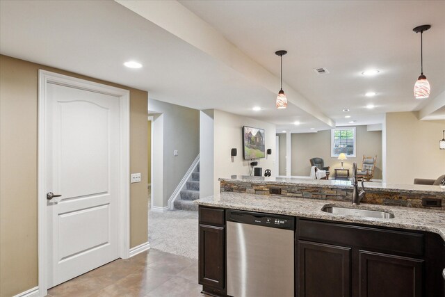 8504 Riverwalk Dr, Fenton, MI 48430 - kitchen featuring stainless steel dishwasher, a sink, dark brown cabinetry, hanging light fixtures, and light stone countertops