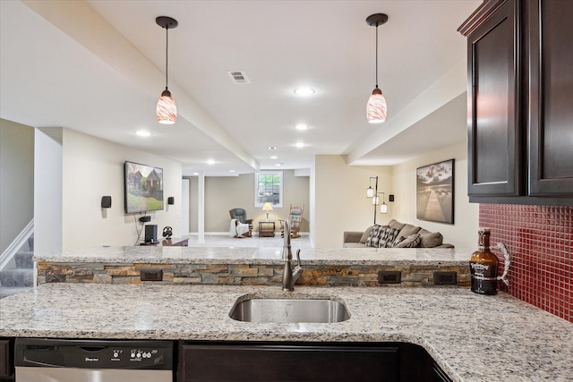 8504 Riverwalk Dr, Fenton, MI 48430 - kitchen with dishwasher, open floor plan, dark brown cabinetry, a sink, and light stone countertops