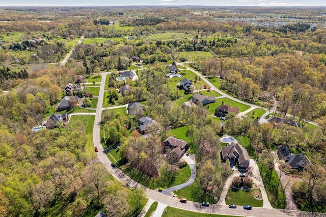 8504 Riverwalk Dr, Fenton, MI 48430 - aerial view of property and surrounding area featuring a forest and nearby suburban area