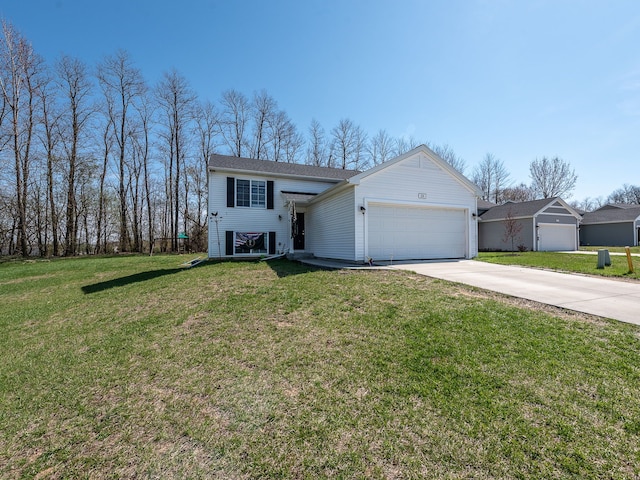 159 St Clair Cir, Brooklyn, MI 49230 - view of front facade with a front lawn, driveway, and a garage