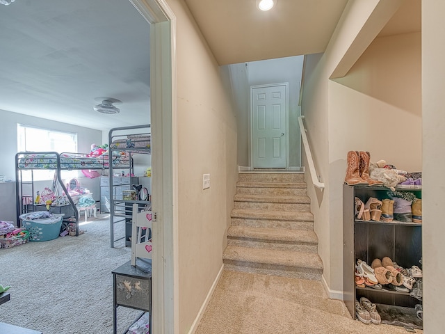 159 St Clair Cir, Brooklyn, MI 49230 - staircase featuring carpet floors and baseboards