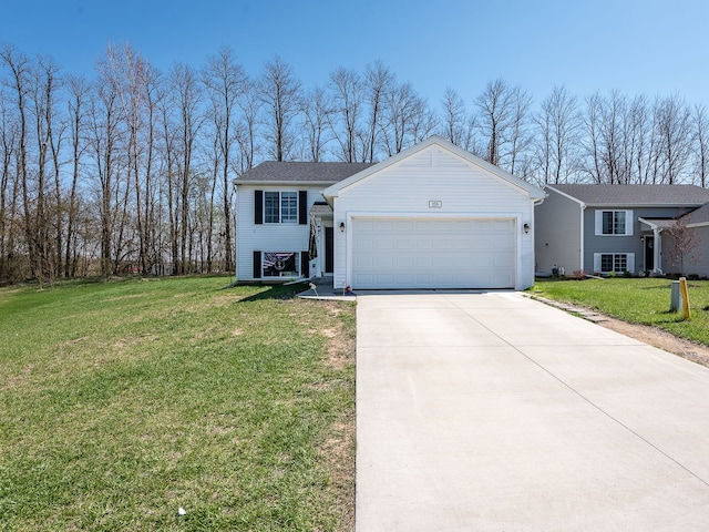 159 St Clair Cir, Brooklyn, MI 49230 - view of front of house with driveway, a front yard, and a garage