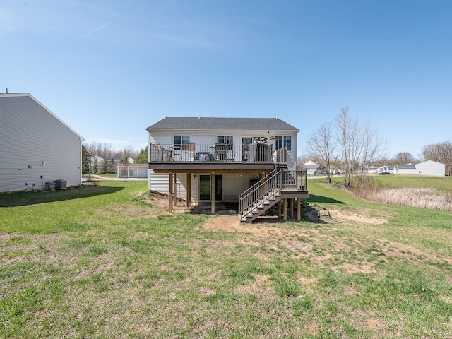 159 St Clair Cir, Brooklyn, MI 49230 - back of property featuring a wooden deck, a lawn, and stairs