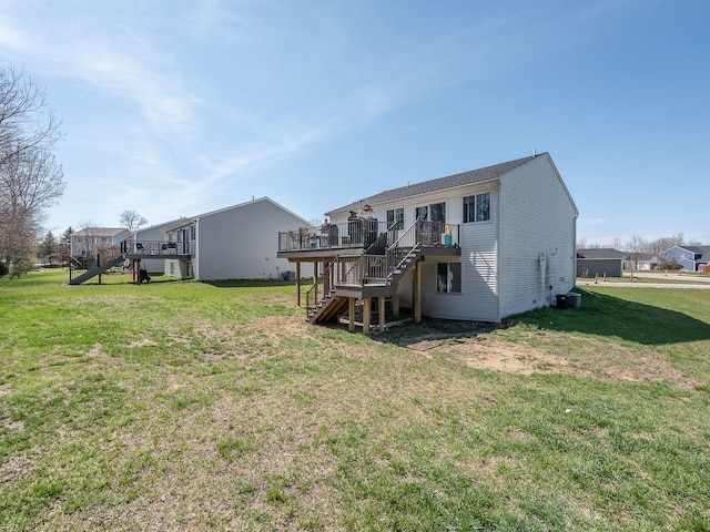 159 St Clair Cir, Brooklyn, MI 49230 - rear view of property featuring a wooden deck, central air condition unit, a lawn, and stairway