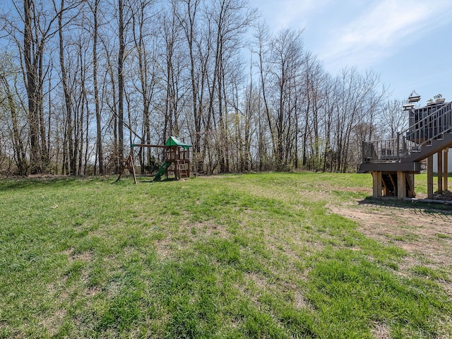 159 St Clair Cir, Brooklyn, MI 49230 - view of yard with a deck, stairs, and a playground