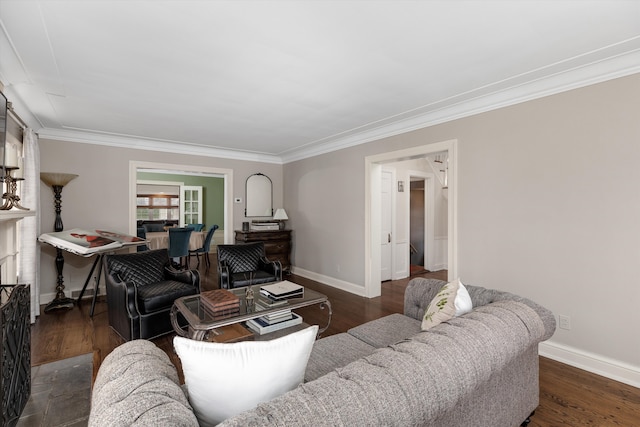 living area featuring crown molding, baseboards, and wood finished floors