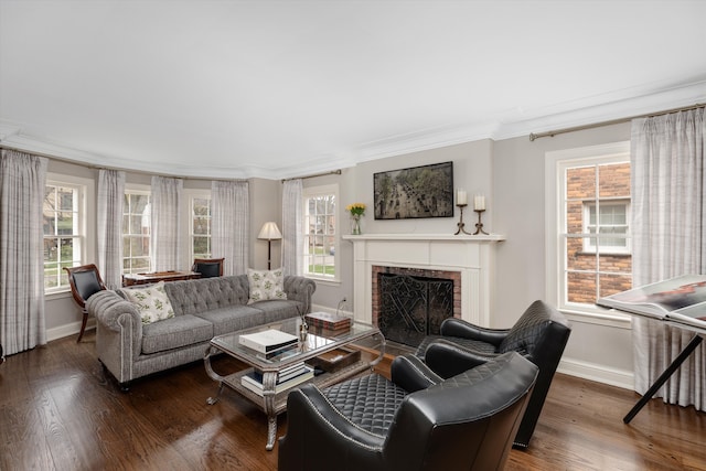 living area featuring crown molding, baseboards, plenty of natural light, and a fireplace with flush hearth