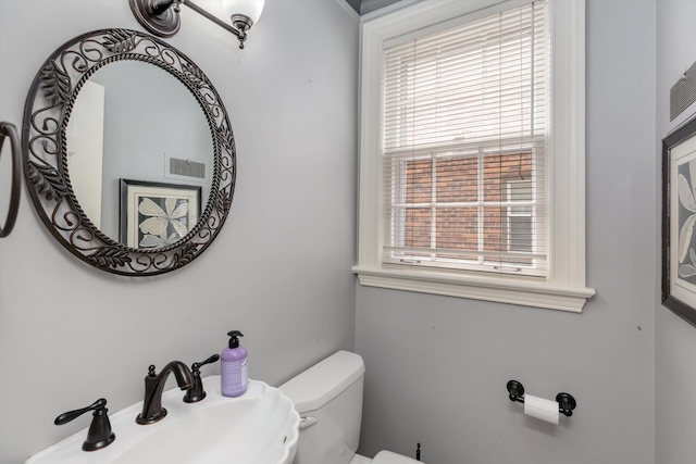 half bathroom with a sink and toilet