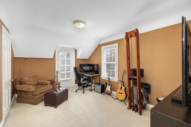 office space featuring carpet flooring, baseboards, and lofted ceiling