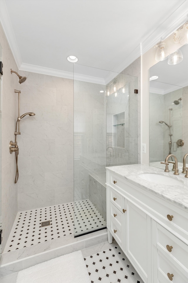 full bathroom with a stall shower, ornamental molding, vanity, and tile patterned floors