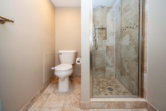 2015 Rugby Ct, Ann Arbor, MI 48103 - bathroom with a stall shower, toilet, and baseboards