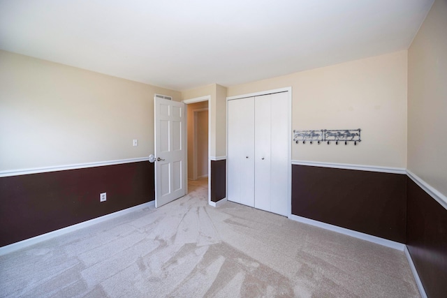 2015 Rugby Ct, Ann Arbor, MI 48103 - unfurnished bedroom featuring a closet, carpet, and baseboards