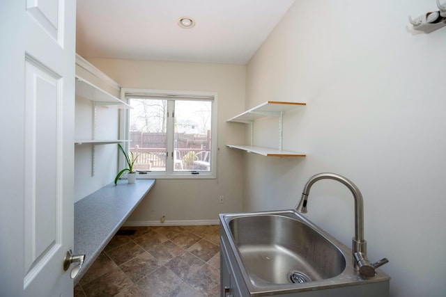 2015 Rugby Ct, Ann Arbor, MI 48103 - washroom featuring a sink and baseboards