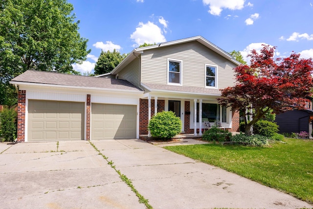 2015 Rugby Ct, Ann Arbor, MI 48103 - traditional home featuring brick siding, a garage, a front lawn, and driveway