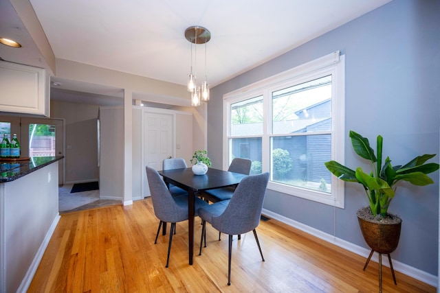 2015 Rugby Ct, Ann Arbor, MI 48103 - dining space with light wood-type flooring, baseboards, plenty of natural light, and a chandelier