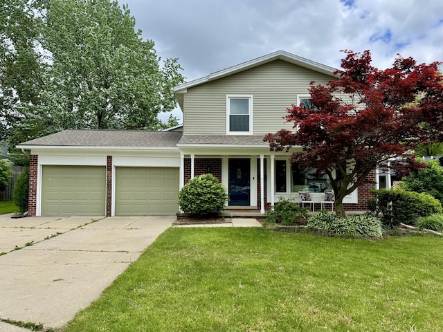 2015 Rugby Ct, Ann Arbor, MI 48103 - traditional-style home with an attached garage, driveway, brick siding, and a front lawn
