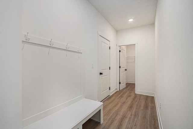 mudroom featuring baseboards, wood finished floors, and recessed lighting