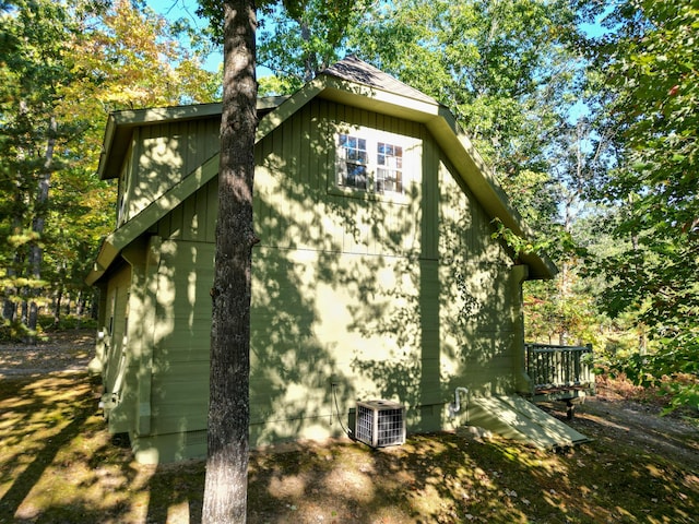 view of side of property featuring crawl space and central AC
