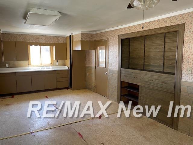 5225 N Vassar Rd, Akron, MI 48701 - interior space with light countertops, wallpapered walls, and plenty of natural light