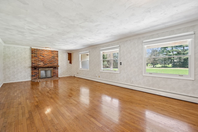 2050 Rowe Rd, Milford, MI 48380 - unfurnished living room featuring wallpapered walls, a fireplace, hardwood / wood-style floors, and crown molding