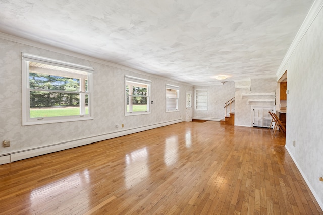 2050 Rowe Rd, Milford, MI 48380 - unfurnished living room with stairs, hardwood / wood-style floors, ornamental molding, baseboard heating, and baseboards