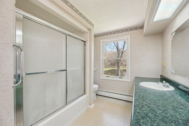 2050 Rowe Rd, Milford, MI 48380 - bathroom featuring toilet, vanity, tile patterned floors, a baseboard radiator, and combined bath / shower with glass door