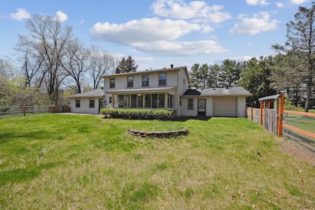 2050 Rowe Rd, Milford, MI 48380 - rear view of house with a fenced backyard, a sunroom, an attached garage, and a chimney