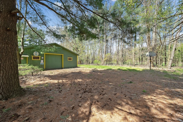 2050 Rowe Rd, Milford, MI 48380 - view of yard with a garage and an outbuilding