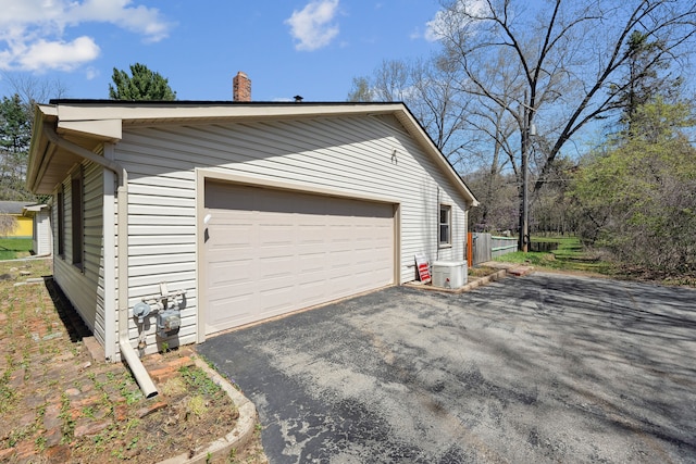 2050 Rowe Rd, Milford, MI 48380 - view of home's exterior with a chimney