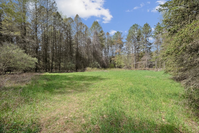 2050 Rowe Rd, Milford, MI 48380 - view of yard with a wooded view
