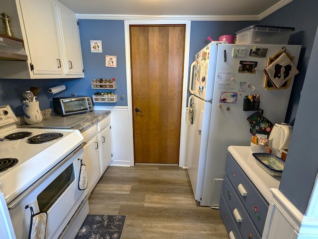 kitchen featuring white cabinetry, under cabinet range hood, a toaster, and white appliances