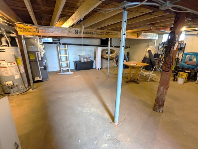 basement with water heater and heating unit
