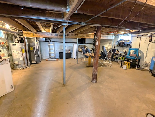 unfinished basement featuring gas water heater and heating unit