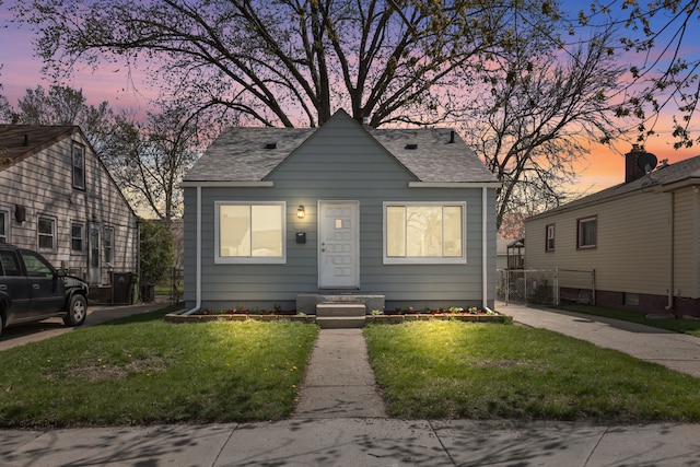 28320 Hillview St, Roseville, MI 48066 - bungalow with fence, a shingled roof, and a yard