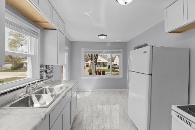 28320 Hillview St, Roseville, MI 48066 - kitchen with a sink, white cabinetry, white appliances, marble finish floor, and light countertops