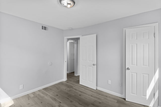 28320 Hillview St, Roseville, MI 48066 - unfurnished bedroom featuring baseboards, wood finished floors, and visible vents