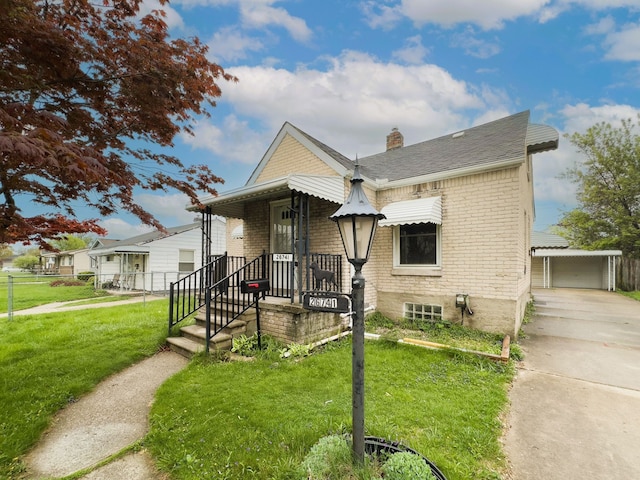 26741 Dartmouth St, Madison Heights, MI 48071 - view of front of house featuring brick siding, a chimney, an outbuilding, and a garage