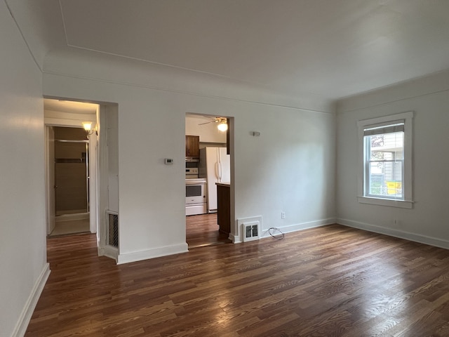 26741 Dartmouth St, Madison Heights, MI 48071 - unfurnished bedroom featuring freestanding refrigerator, dark wood finished floors, and baseboards