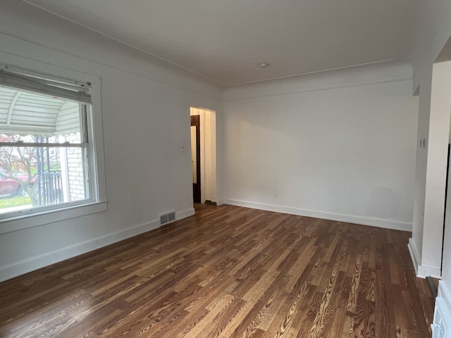 26741 Dartmouth St, Madison Heights, MI 48071 - empty room featuring dark wood-style flooring and baseboards
