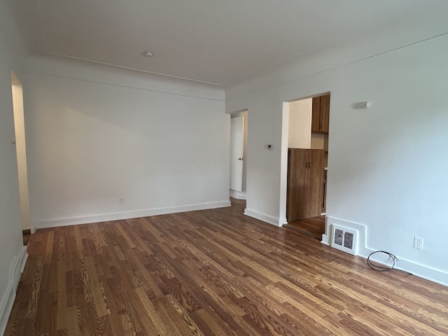 26741 Dartmouth St, Madison Heights, MI 48071 - spare room featuring dark wood finished floors and baseboards